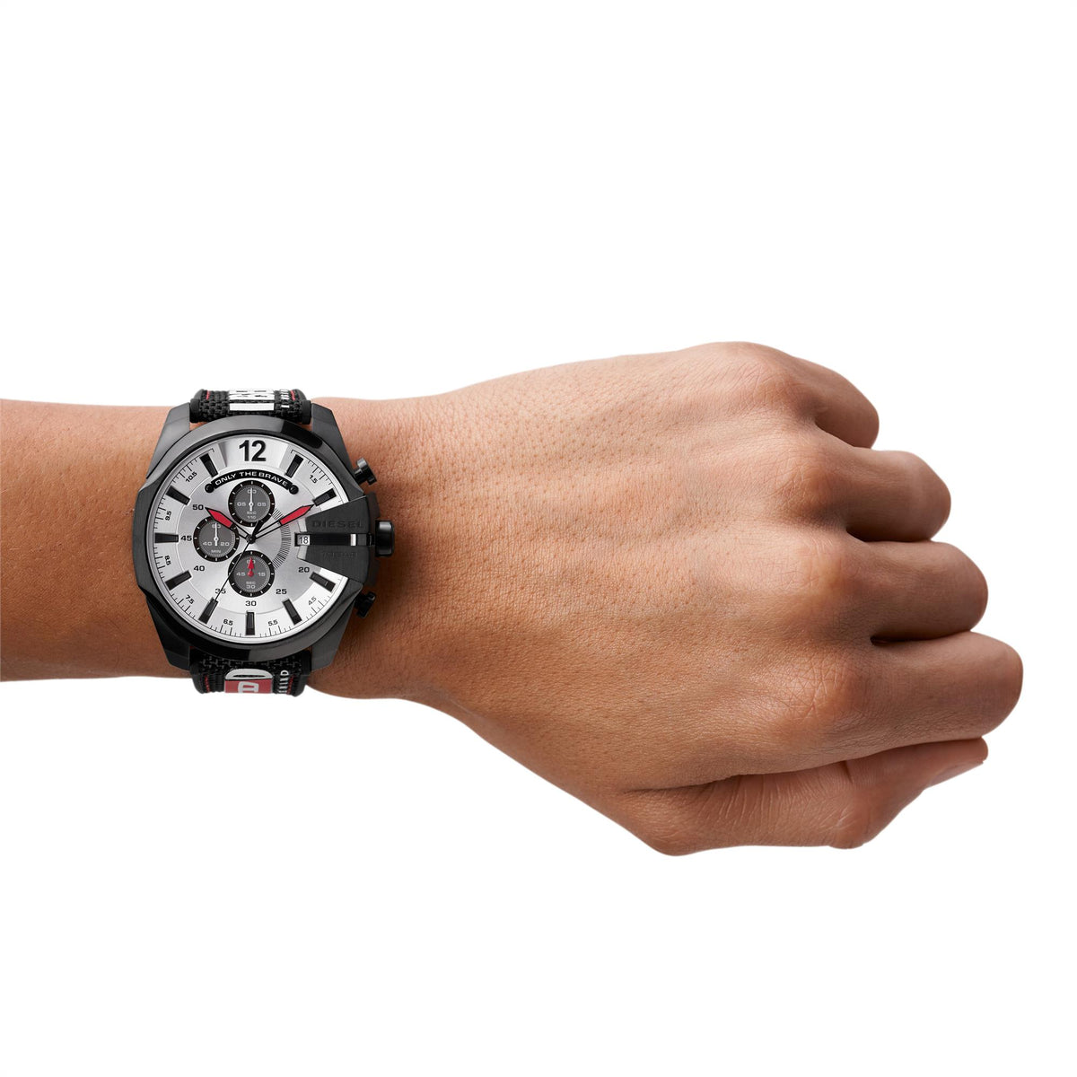 Men's chronograph watch on wrist, black case with silver dial and red subdials, fabric strap