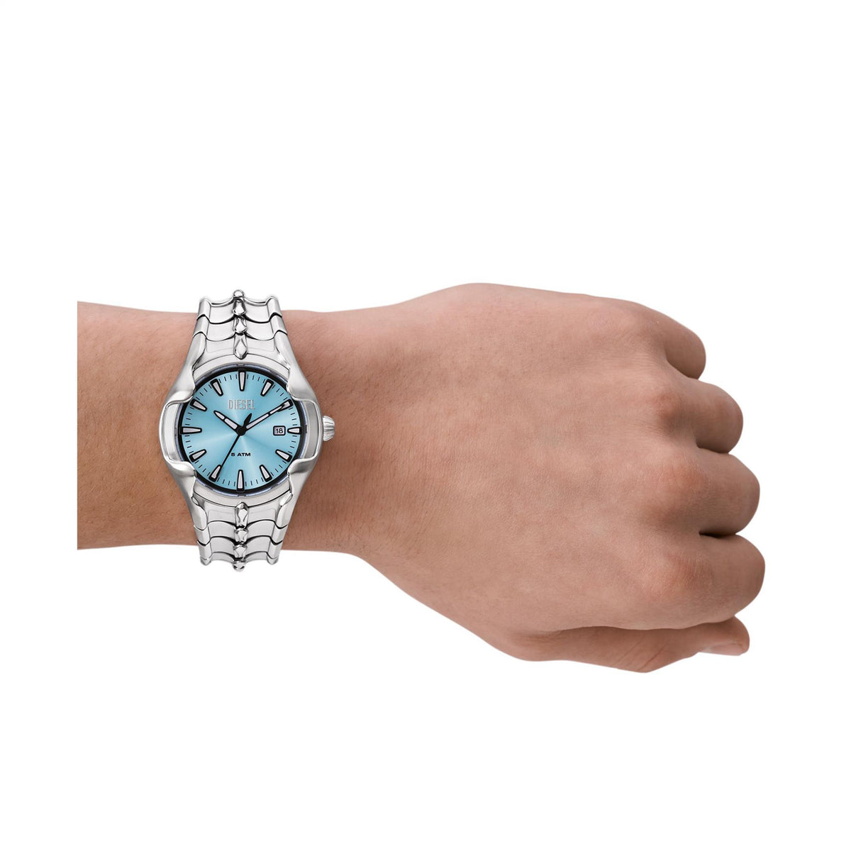 Men's stainless steel quartz watch on wrist, showing blue dial and slim bracelet