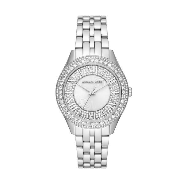 Angled view of silver-tone ladies watch with crystal bezel and white dial.