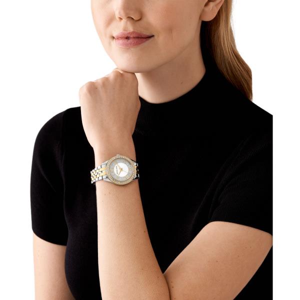 Two-tone stainless steel watch worn on wrist with jeweled bezel and silver face