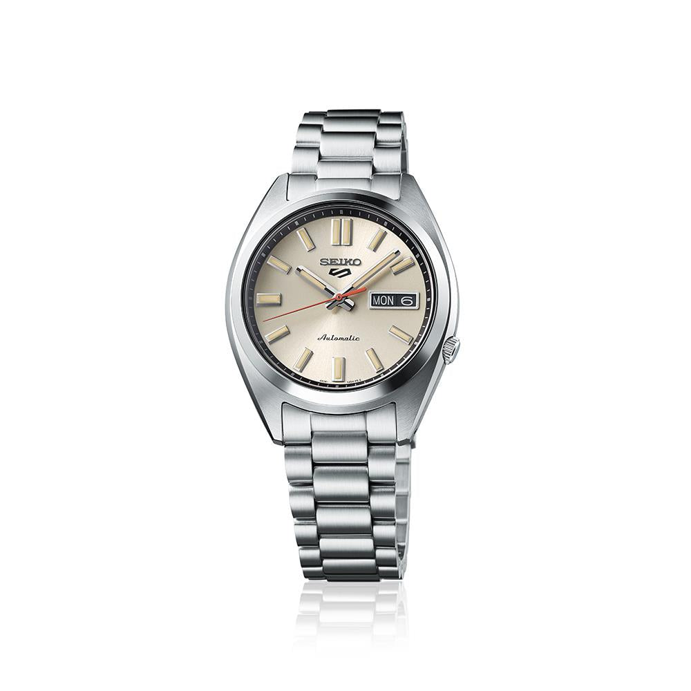 Seiko 5 Sports watch with a 37.4 mm cream dial on a white background