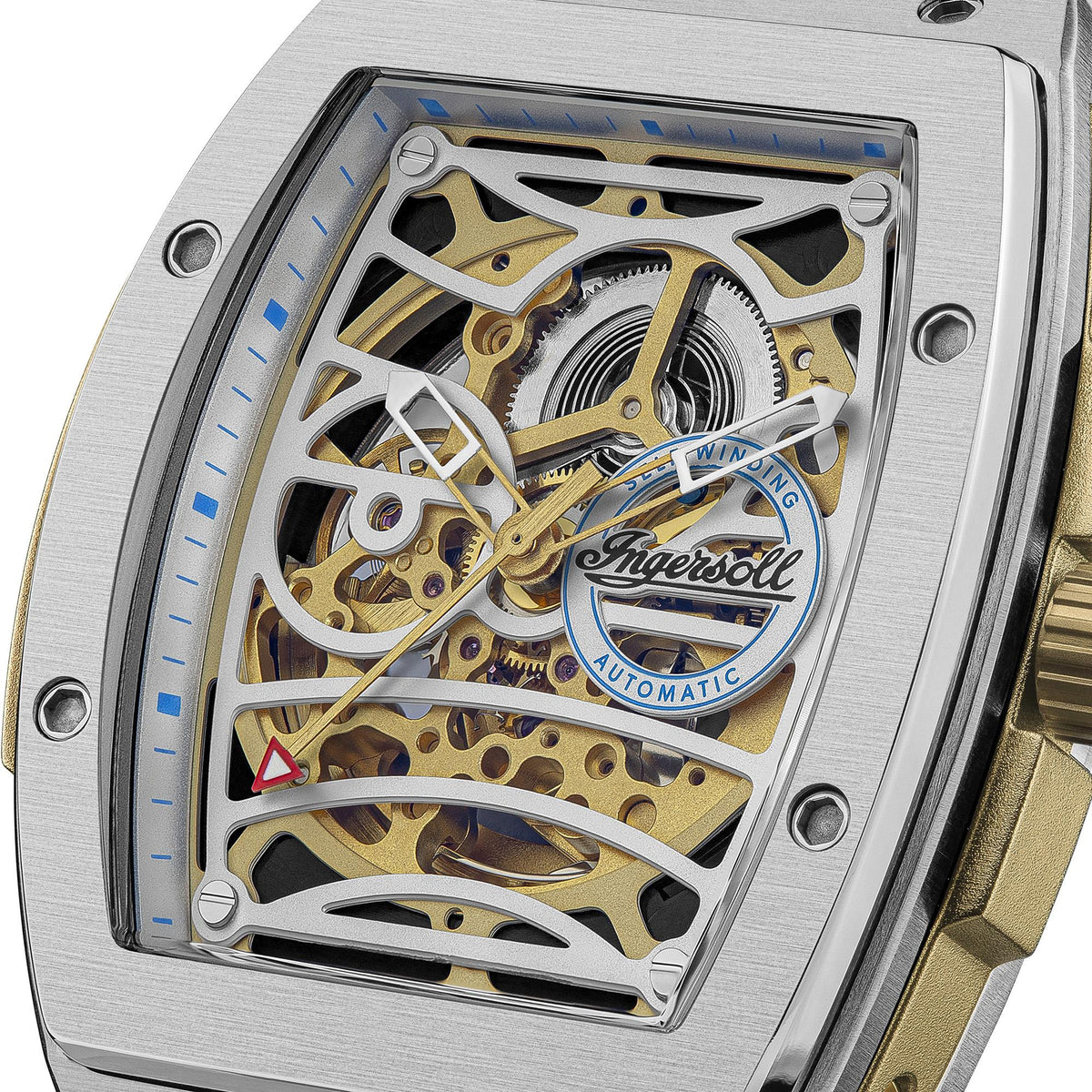 Automatic skeleton watch close-up: gold gears and blue-ring Ingersoll medallion