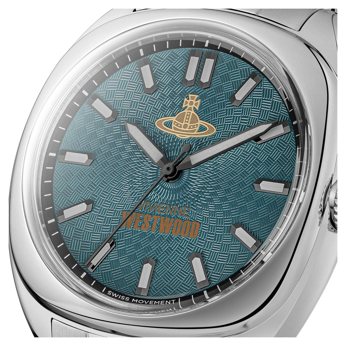 Teal textured watch dial close-up on men's stainless steel case with gold emblem and markers.
