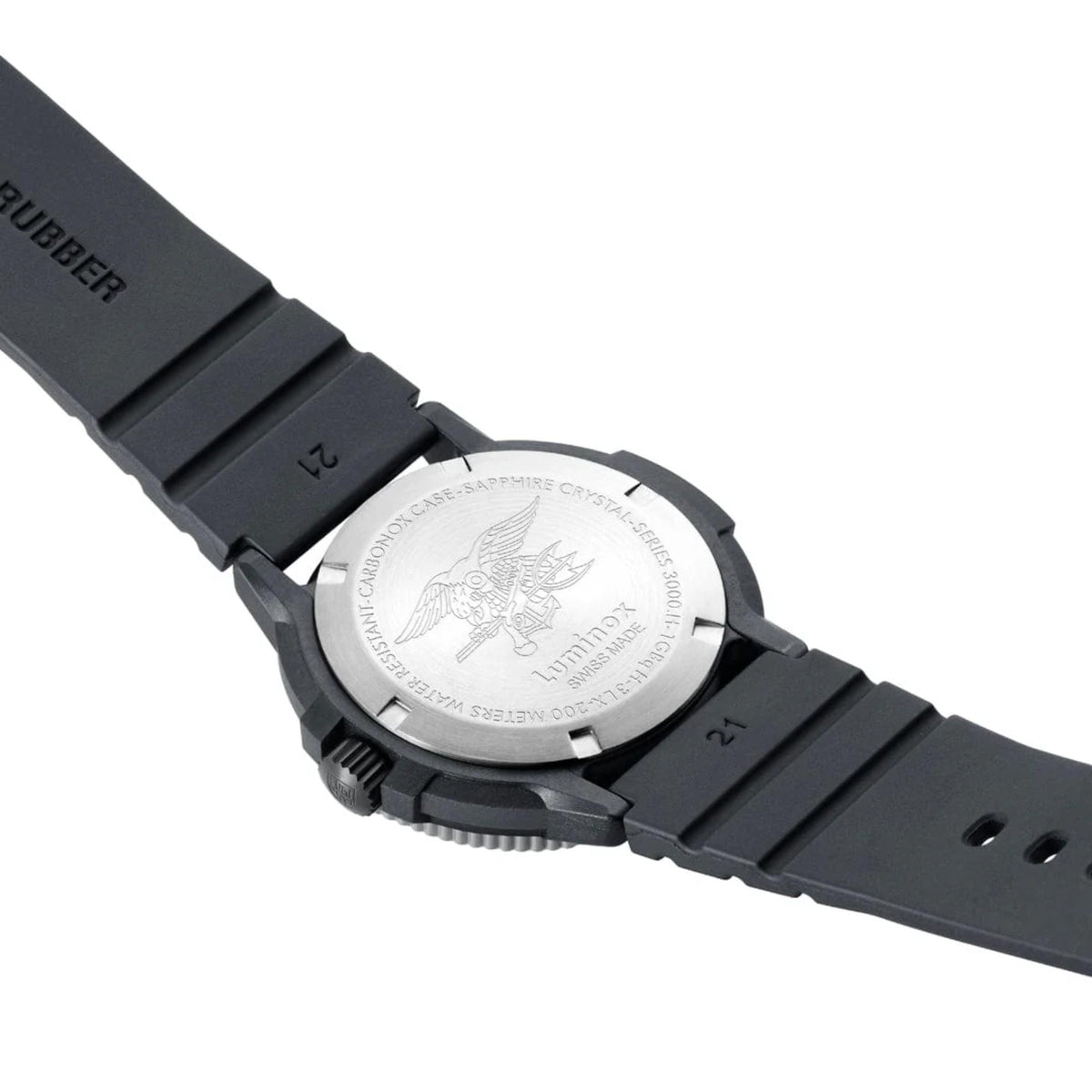 Back of black rubber dive watch with engraved case and ridged crown guard