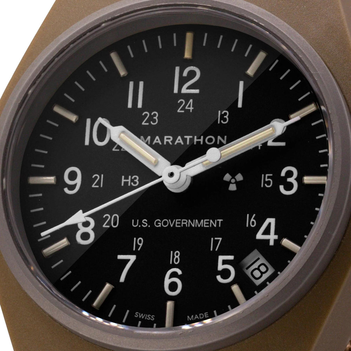 Men's black dial watch close-up with silver hands and U.S. Government date area