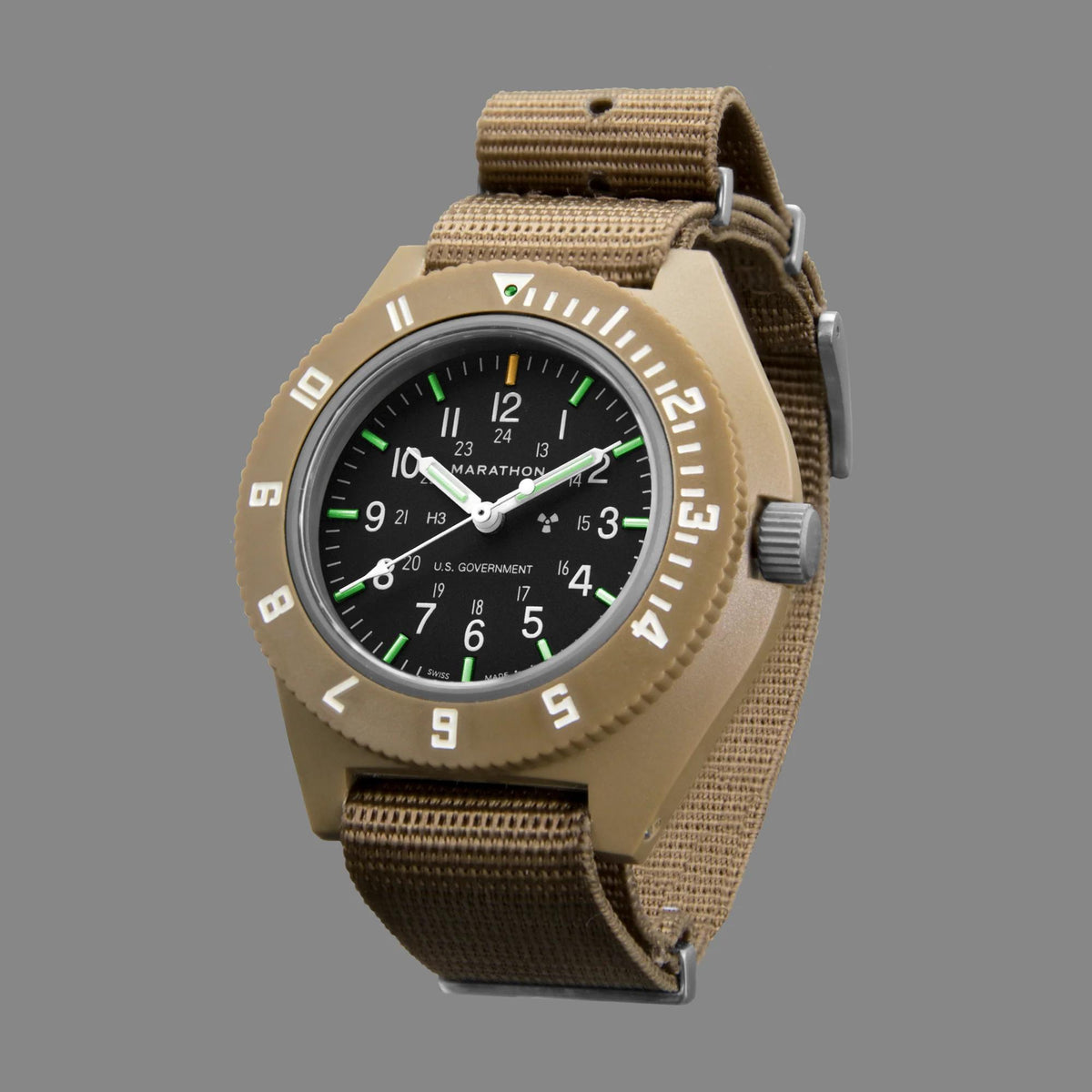 Men’s pilot watch with tan case, black dial, and desert tan fabric strap