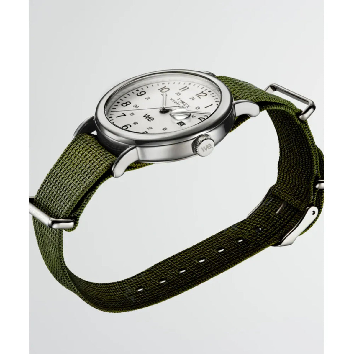 Silver-cased watch with white dial on green fabric strap, three-quarter view