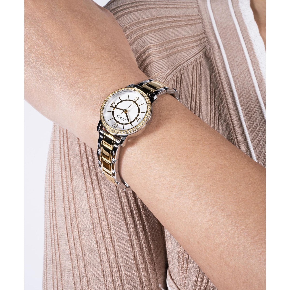 Two-tone stainless steel analog watch with white dial and gold-and-silver bracelet