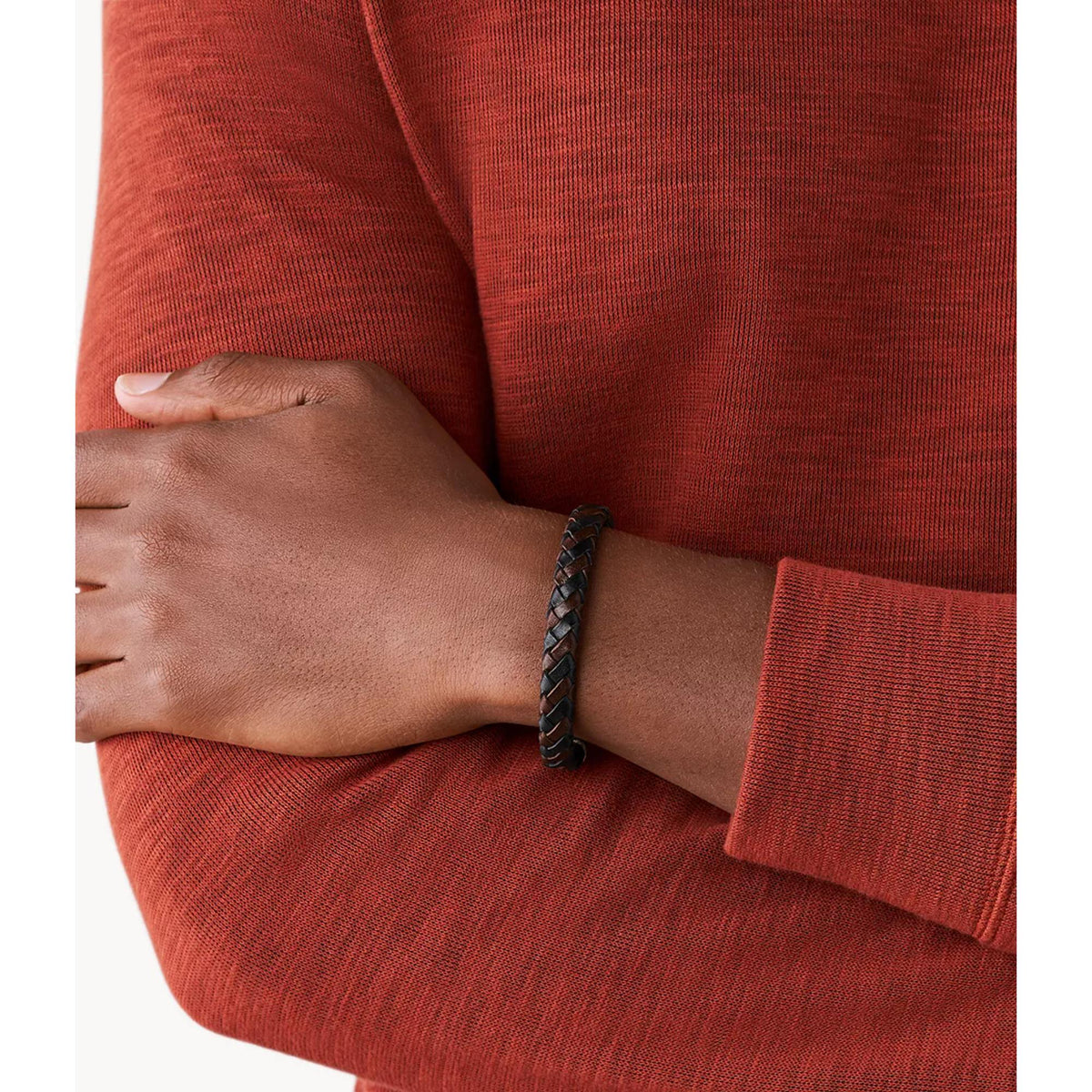 Braided leather mens bracelet on wrist with brown and black braided pattern and clasp