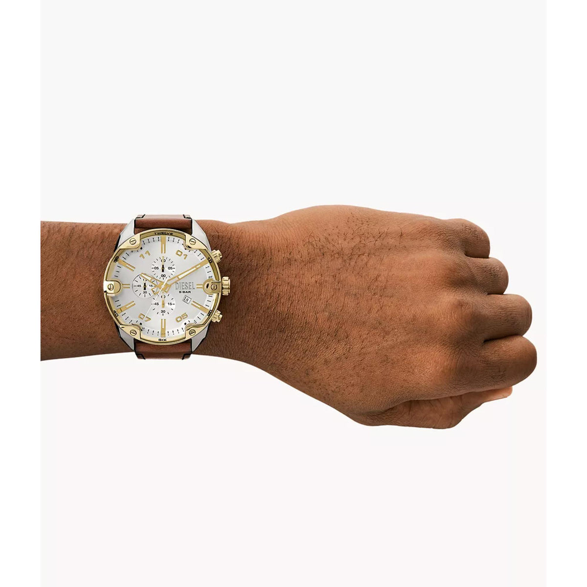 Men's chronograph watch on wrist showing brown leather strap and white dial