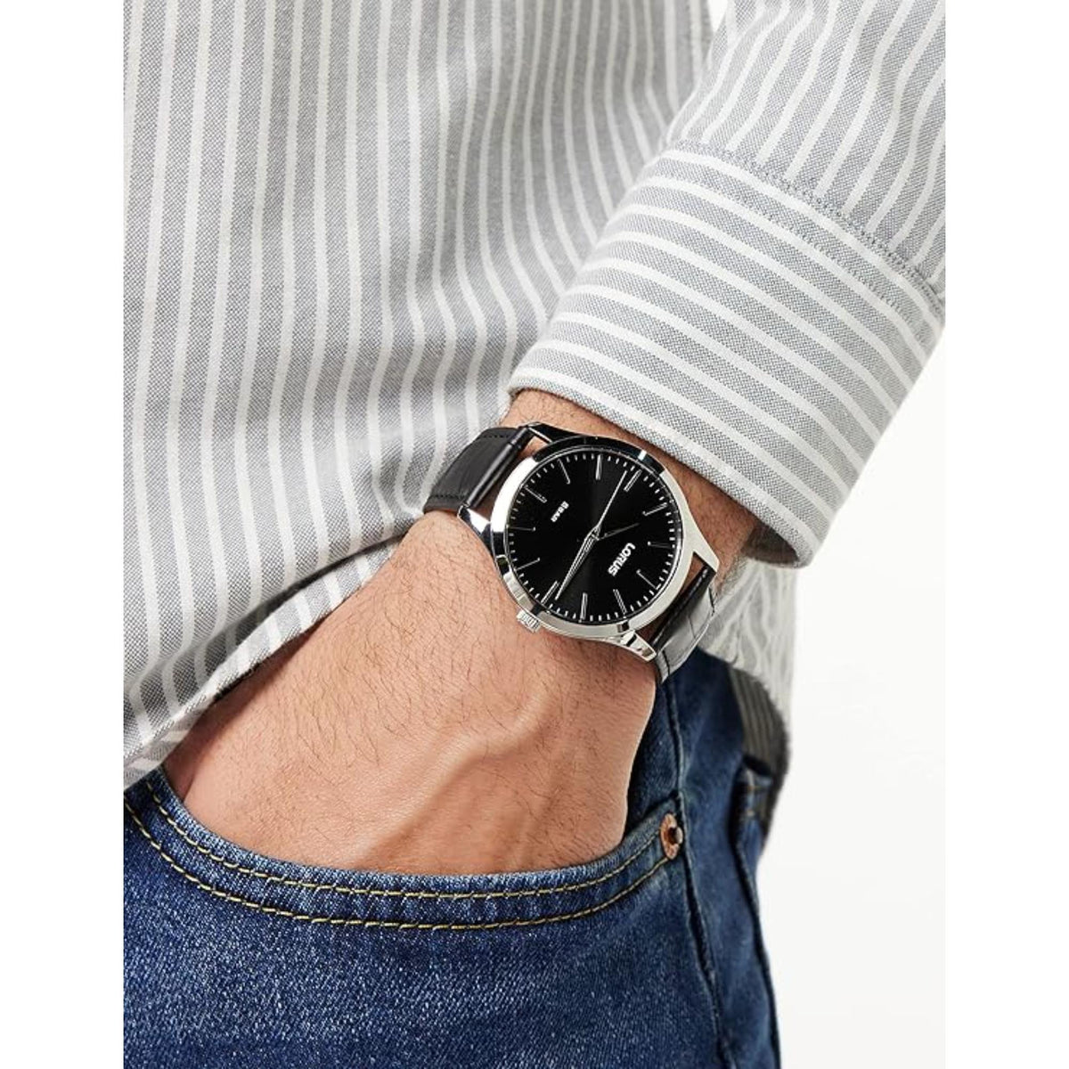 Men's black leather strap watch worn with striped shirt, black dial and silver hands