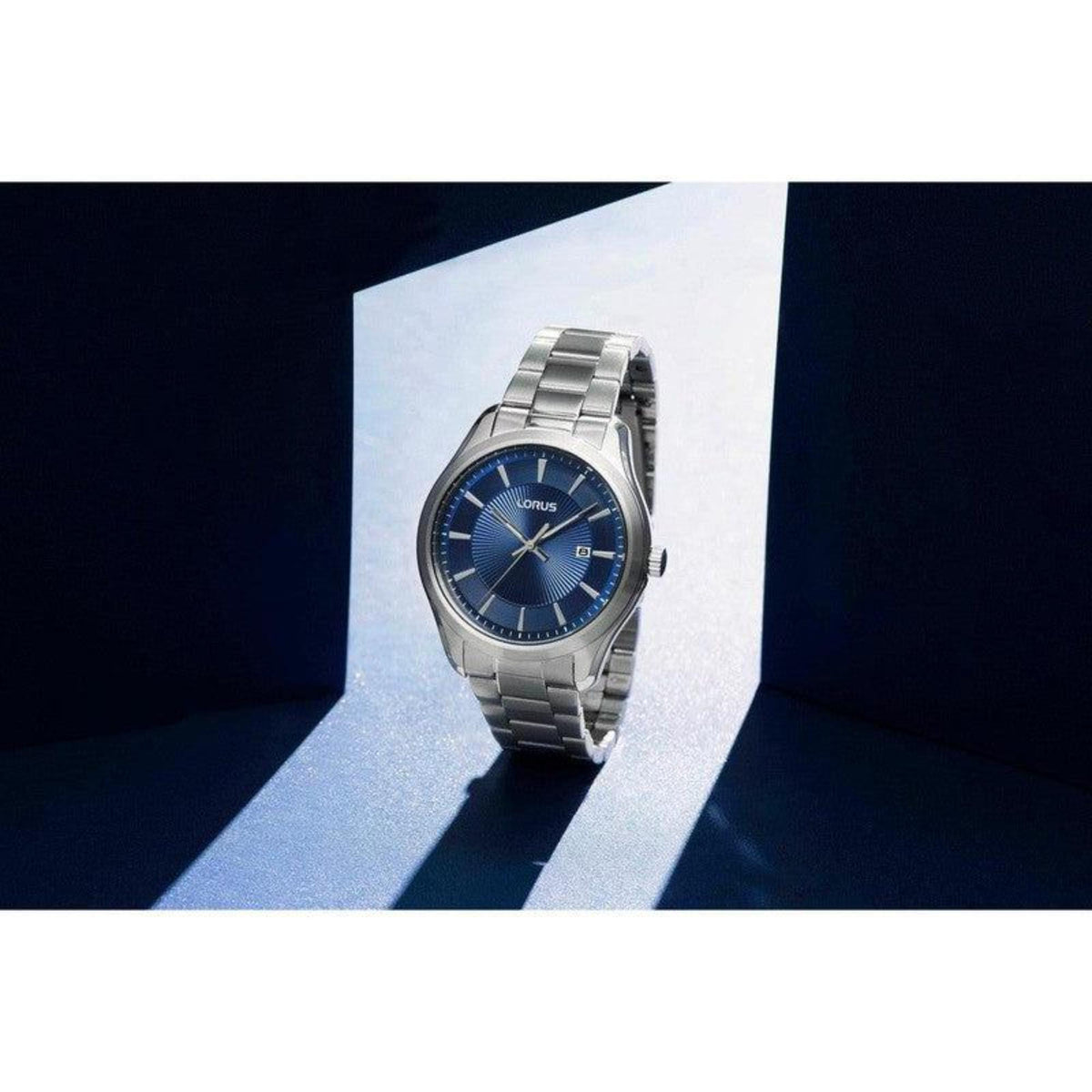 Men's analog quartz watch with blue dial on stainless steel bracelet, angled view