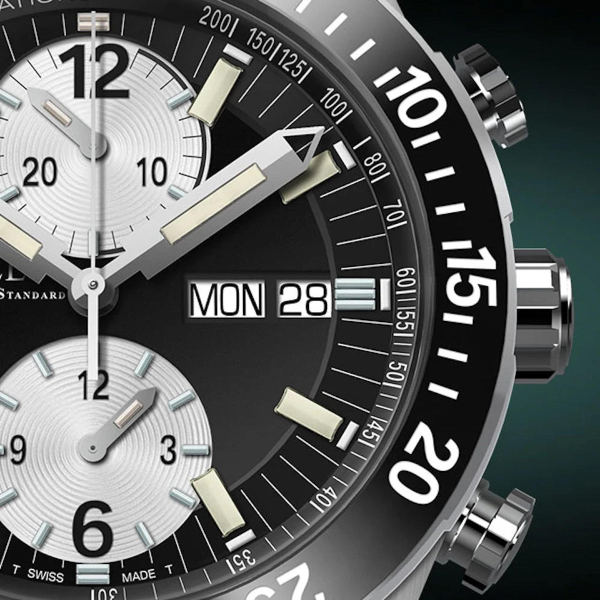 Men's chronograph watch close-up with black dial, MON 28 date window, subdials