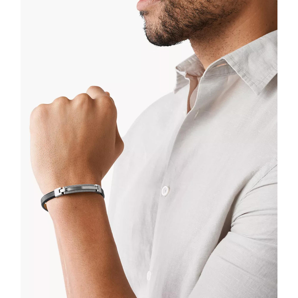 Skagen men's bracelet on wrist, silver buckle clasp and dark gray leather strap