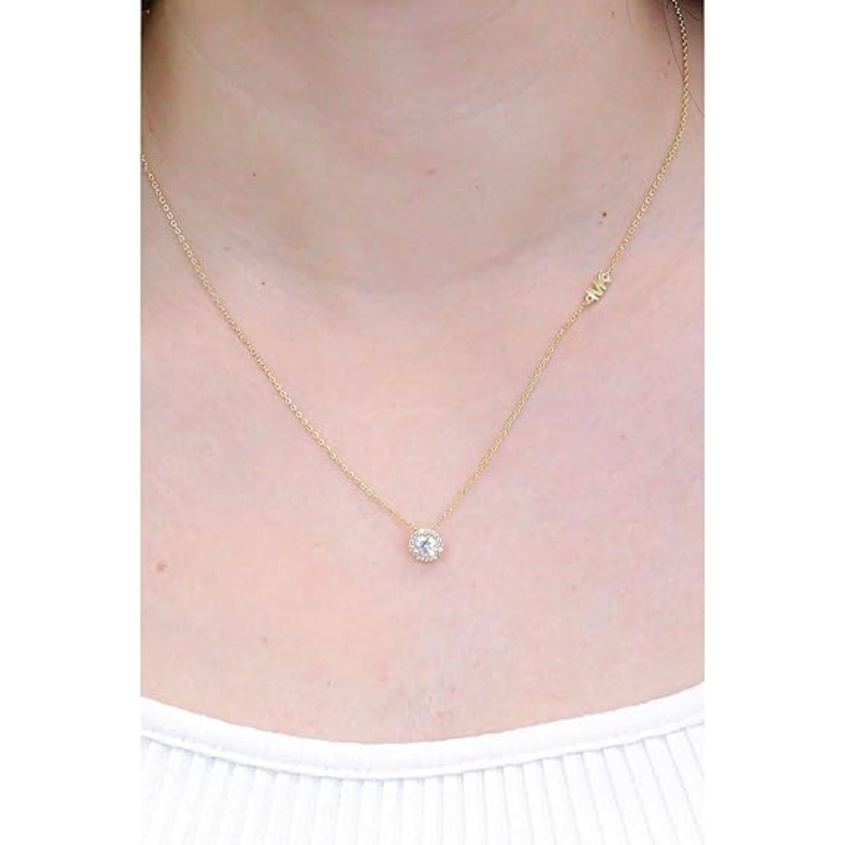 Gold-tone chain necklace with small round CZ solitaire pendant at center front