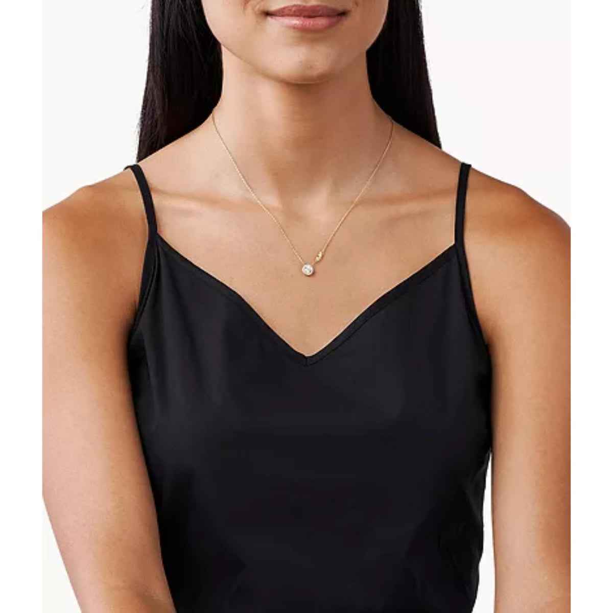 Gold-tone CZ pendant necklace shown on a model wearing a black camisole top