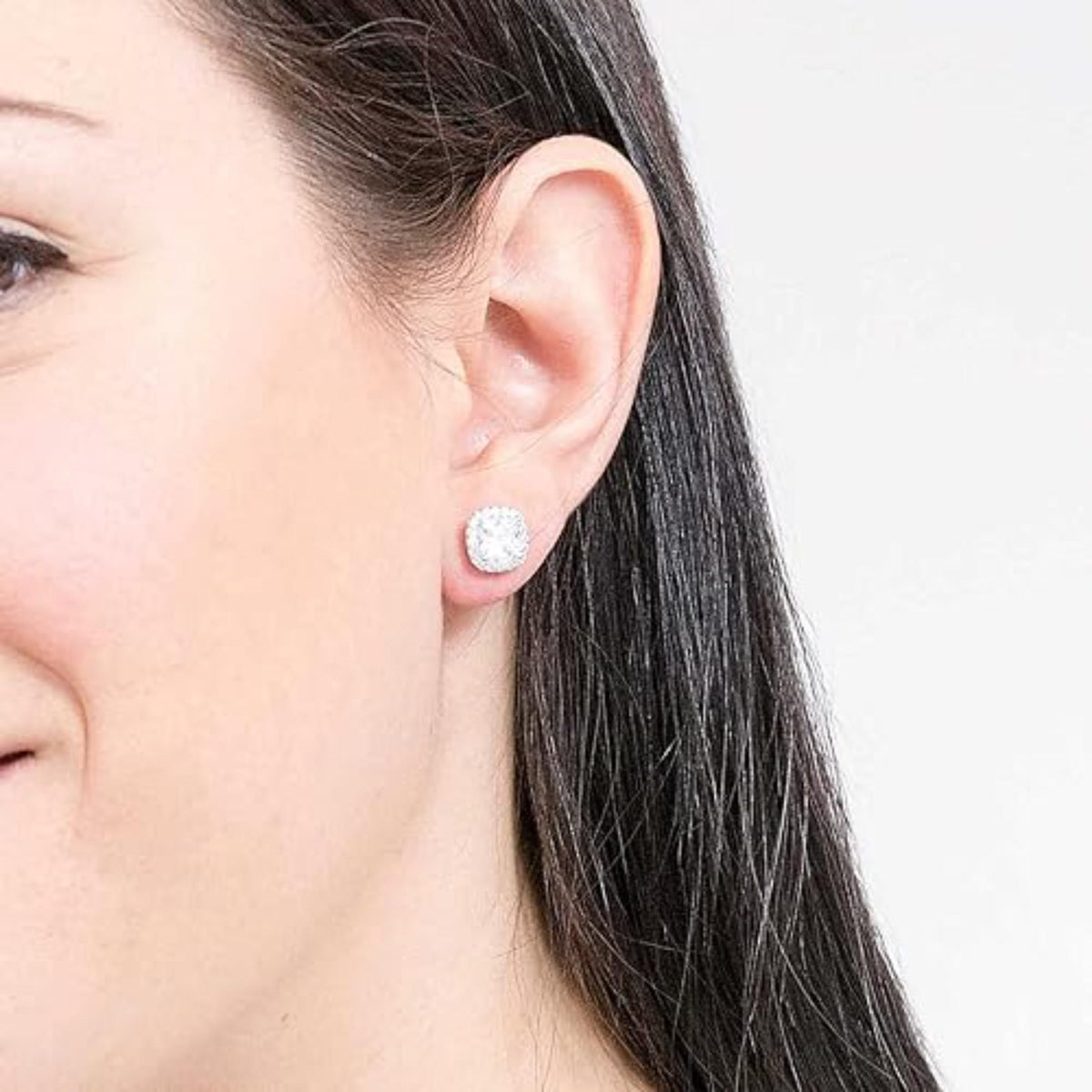 Michael Kors sterling silver cushion-cut stud earring on a woman's ear