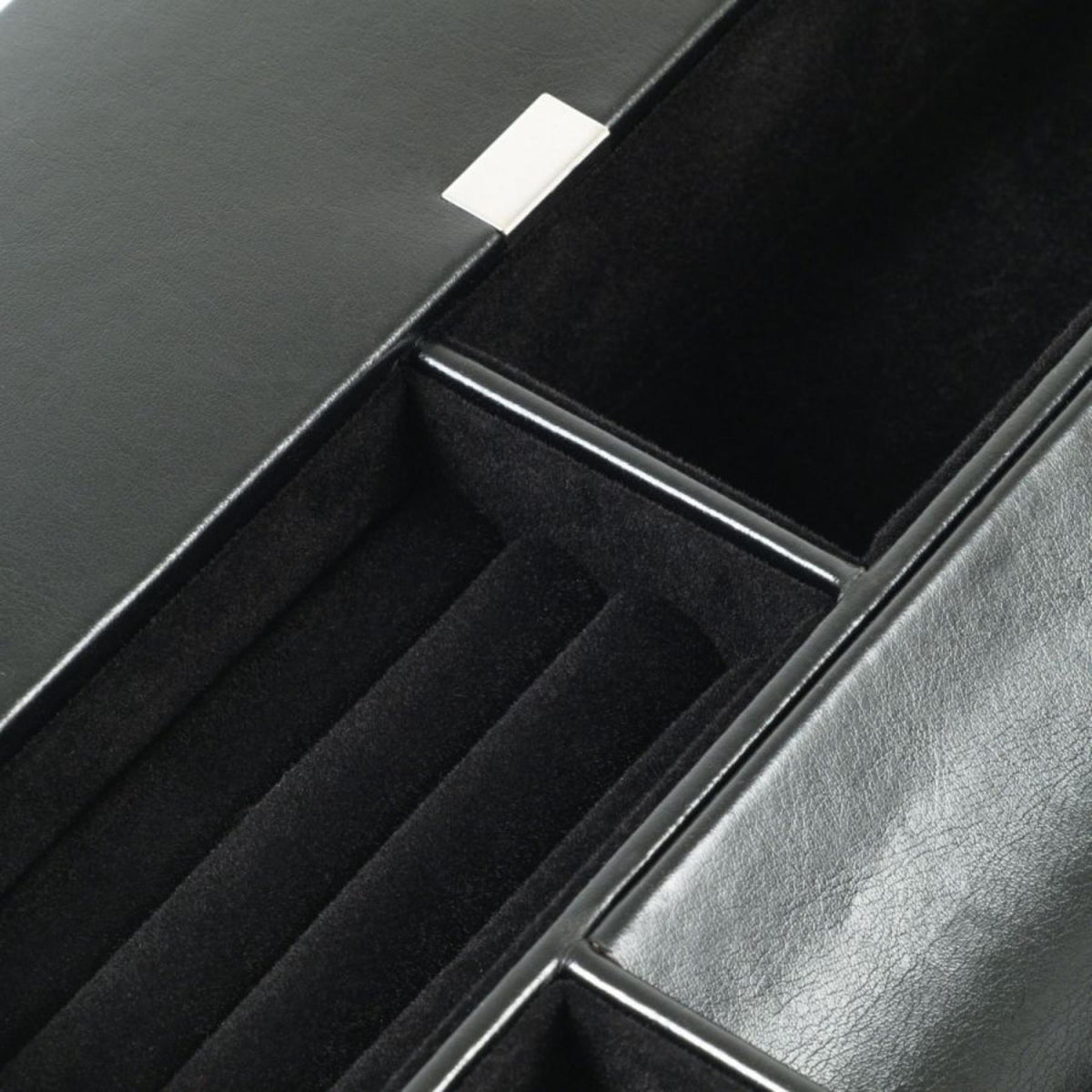 Close-up of leather divider and compartment area inside the valet tray