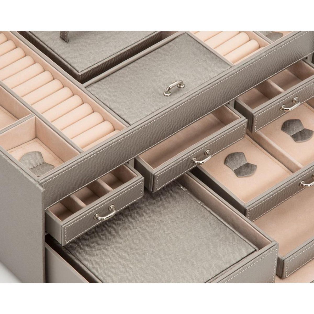Large jewelry box interior layout with cushioned sections, drawers, and organizer trays