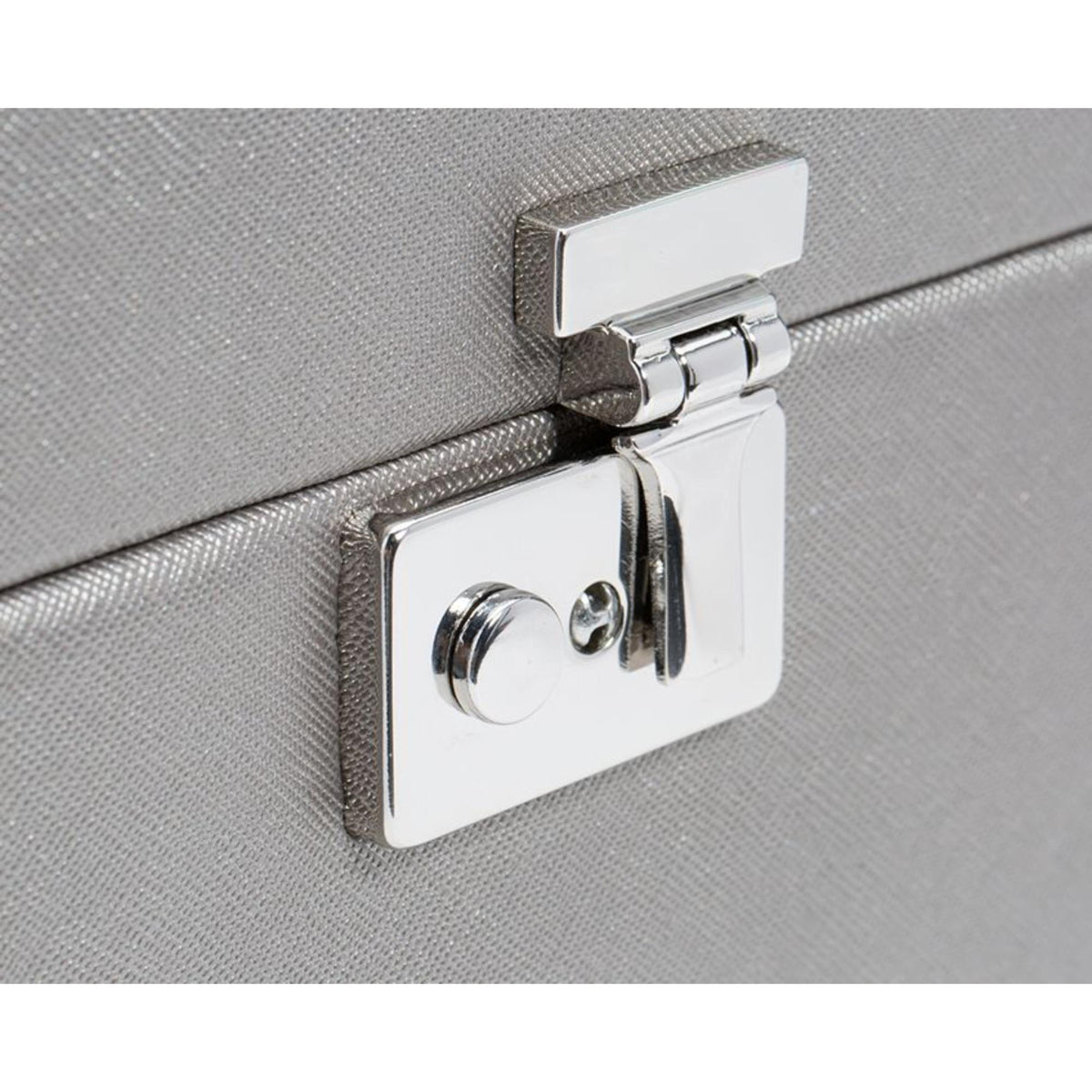 Metal clasp lock with keyhole on tan leather jewelry armoire front panel