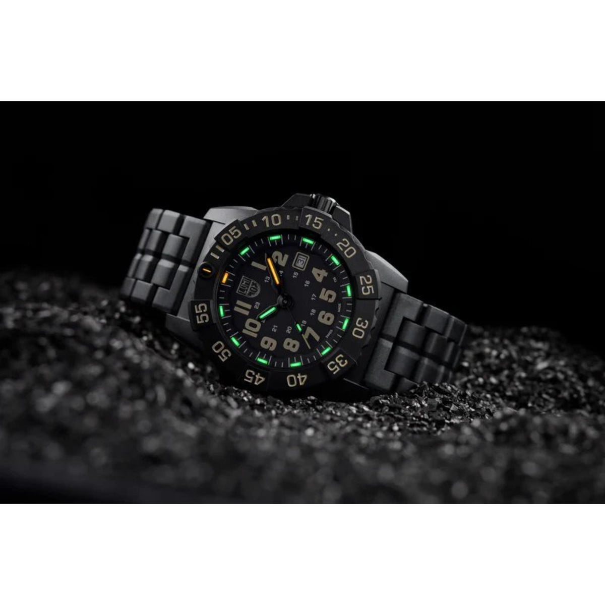 Black men's quartz wristwatch with green illuminated hour markers and date window.