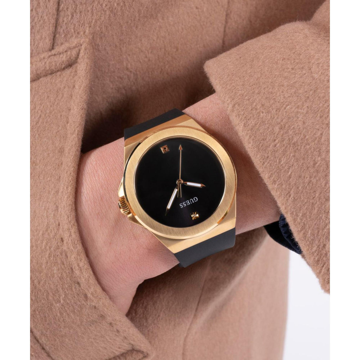 Men's wristwatch with gold-tone case, black dial, and black silicone strap