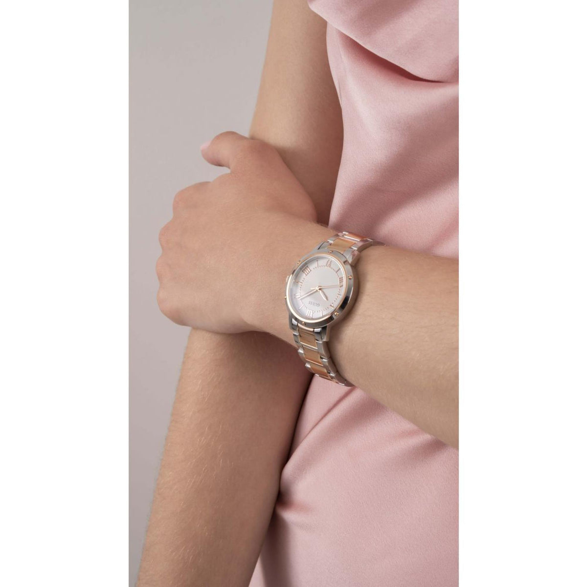 Two-tone stainless steel strap women's watch with round white dial and gold markers