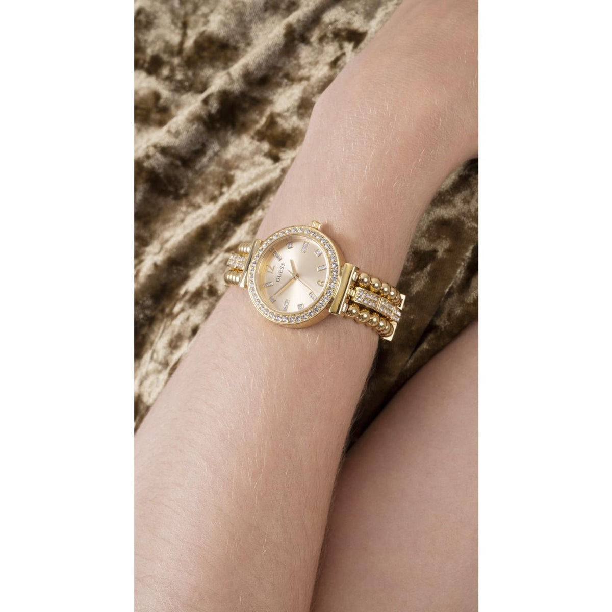 Guess Gala women's gold-tone watch with champagne dial, rhinestone bezel, beaded strap
