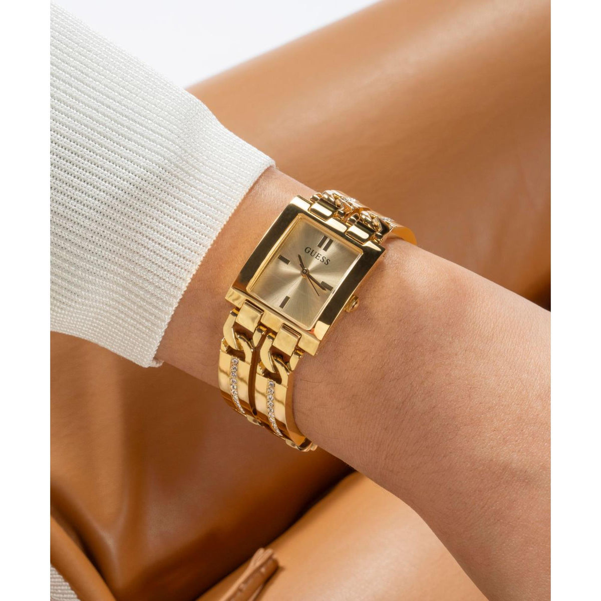 Women’s gold-tone stainless steel strap watch with champagne dial and rectangular bezel