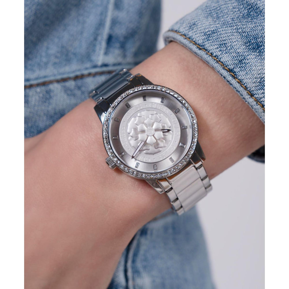 Women’s silver dial stainless steel watch with rhinestone bezel and link bracelet