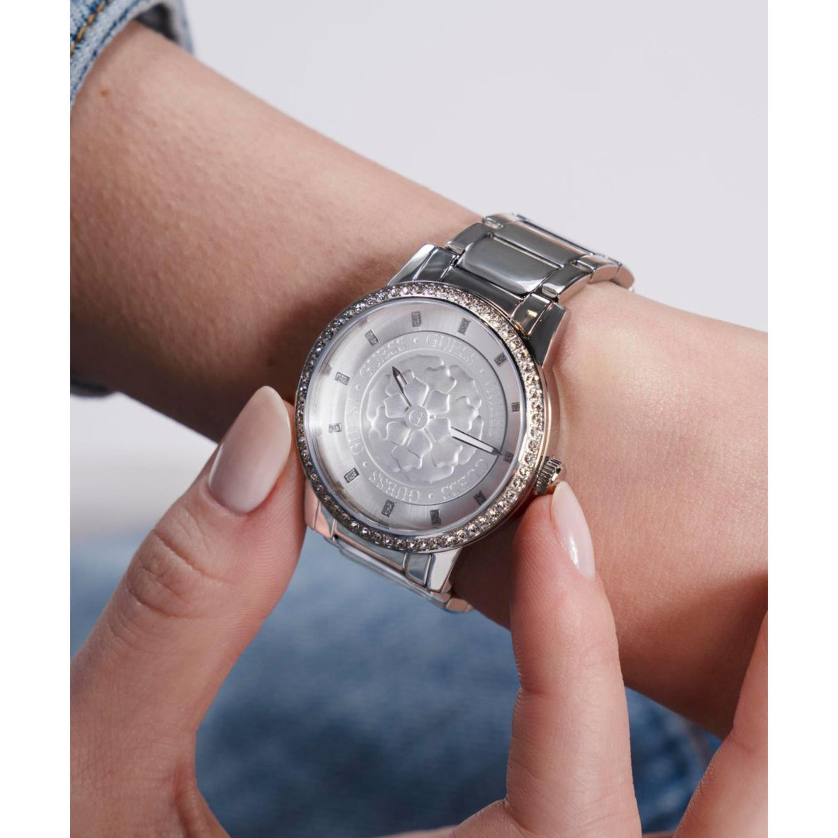 Women’s wristwatch with silver textured dial and crystal-studded bezel