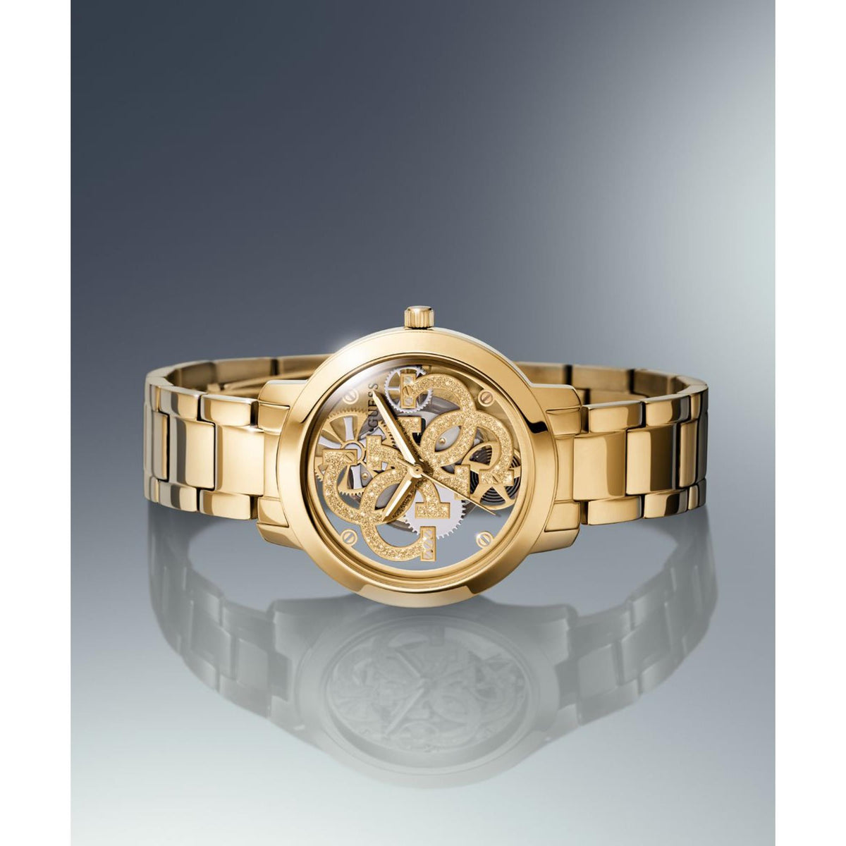 Gold-tone skeleton dial watch with openwork hands and round bezel on metal bracelet