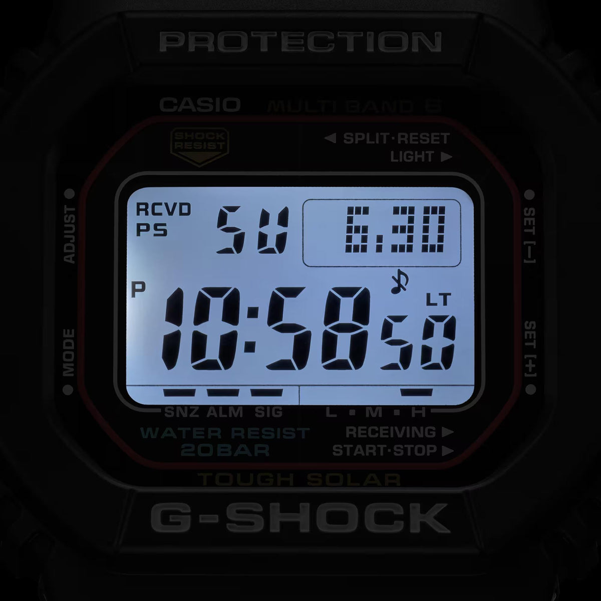 Close-up of black digital watch face with illuminated LCD time and icons