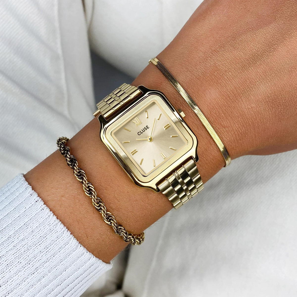 Women's gold-tone square quartz watch with gold dial and metal link bracelet