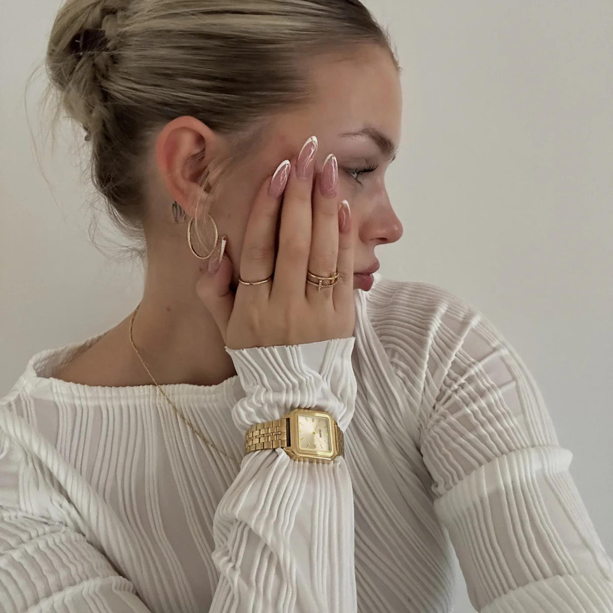 Women's gold-tone square quartz watch with gold dial and metal link bracelet