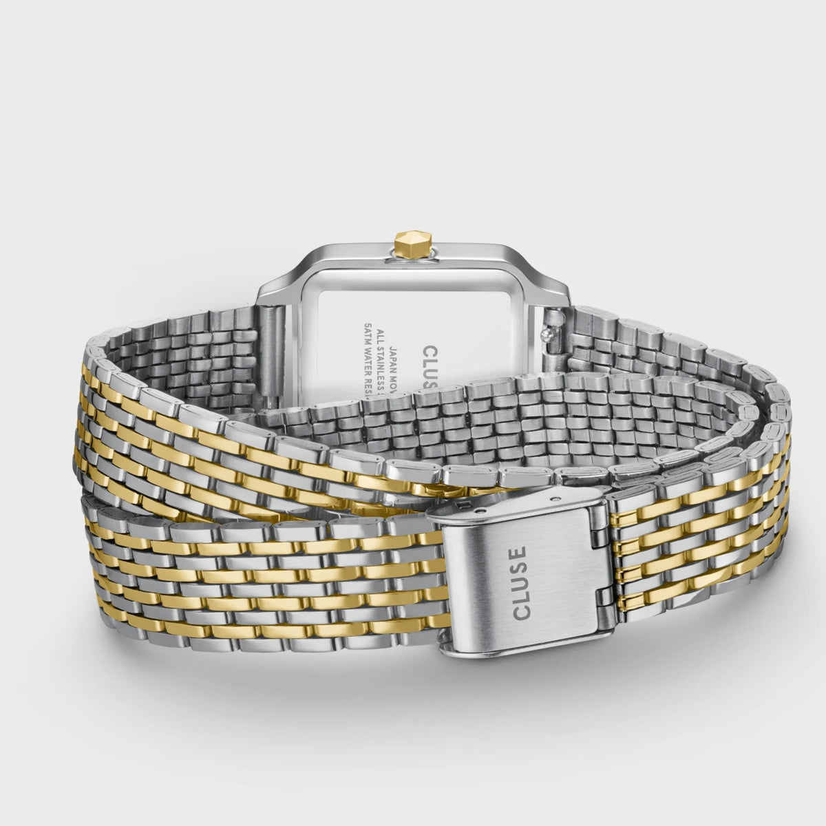 Two-tone metal wristwatch with gold accents and clasp, detailed band view