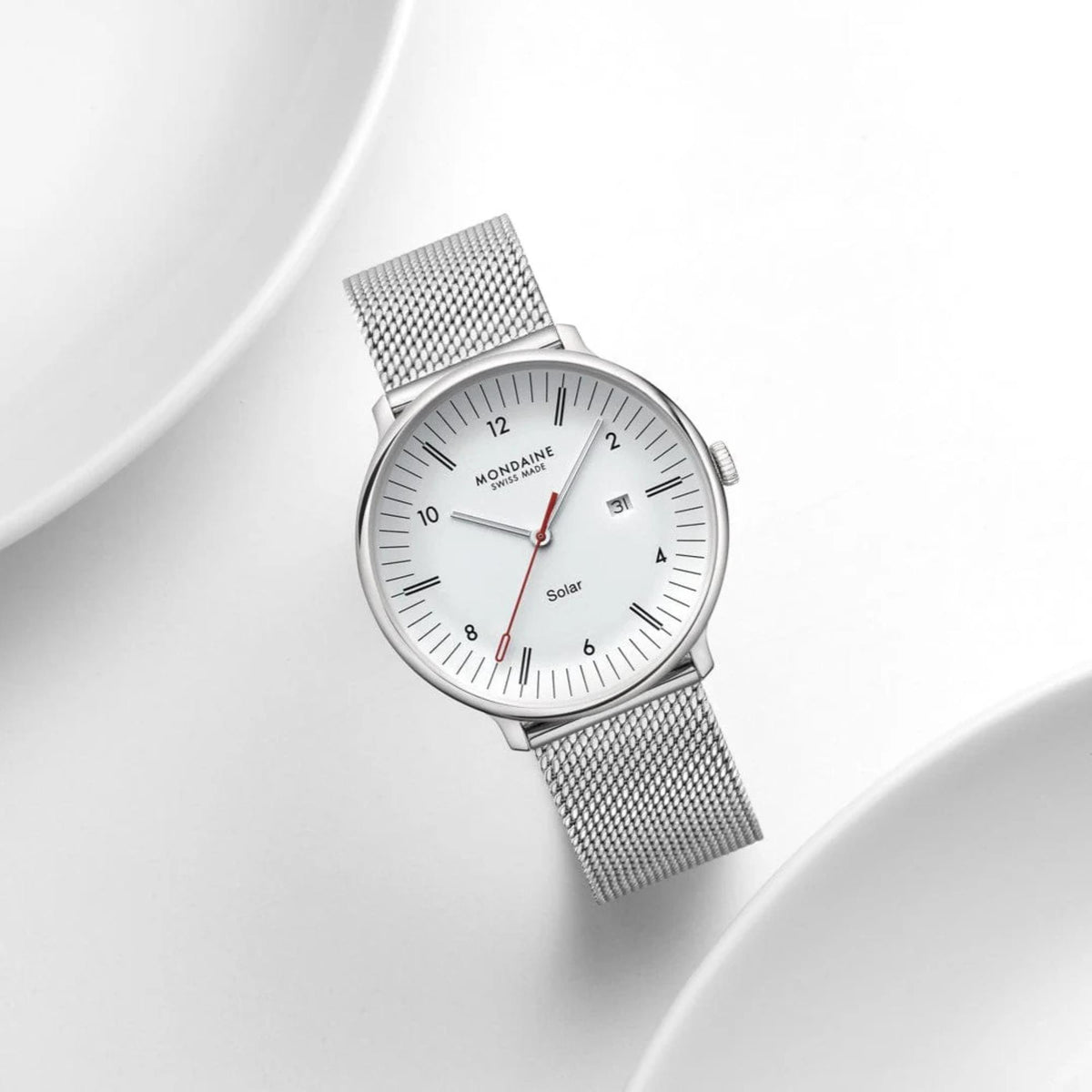 Mondaine Doppio MLE.41910.SM solar white dial steel strap watch studio display overhead view