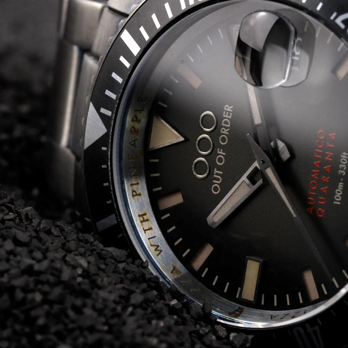 Men's automatic wrist watch with black dial and steel bezel, close-up view