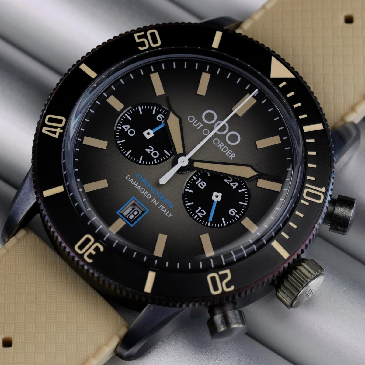 Men's pilot chronograph watch front: black dial, three subdials, tan leather strap