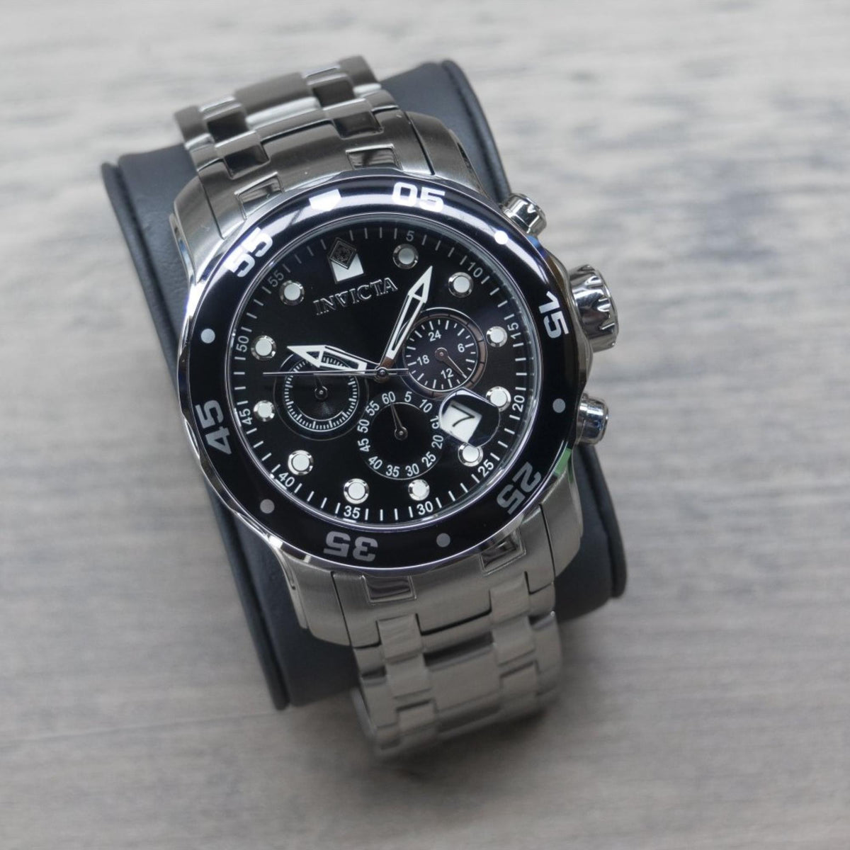 Men's Invicta chronograph wristwatch, black dial, steel link bracelet, round bezel