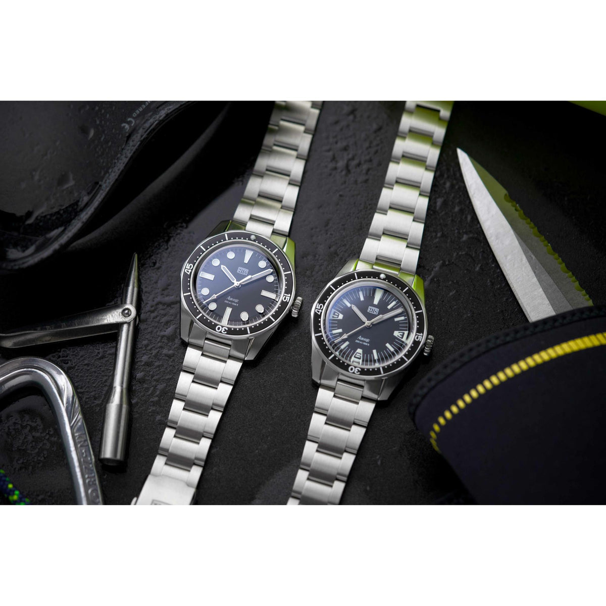Stainless steel diver watch with dark blue dial, luminous bezel, and link bracelet