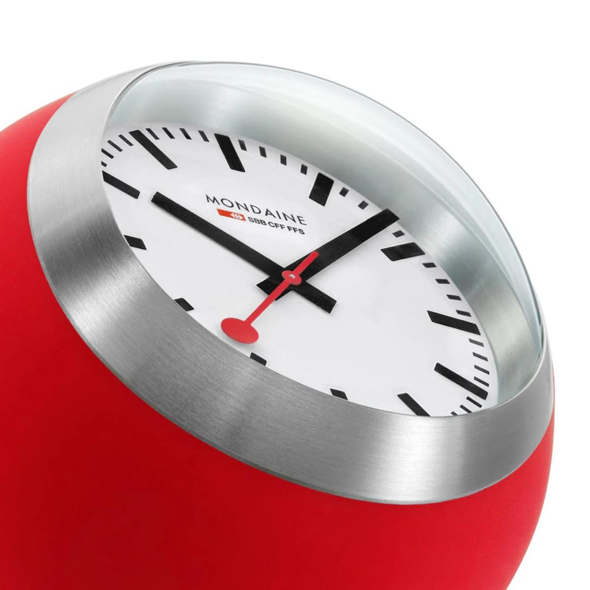 Mondaine Globe table clock A660.30335.16SBP close-up side angle highlighting curved lens and brushed metal bezel
