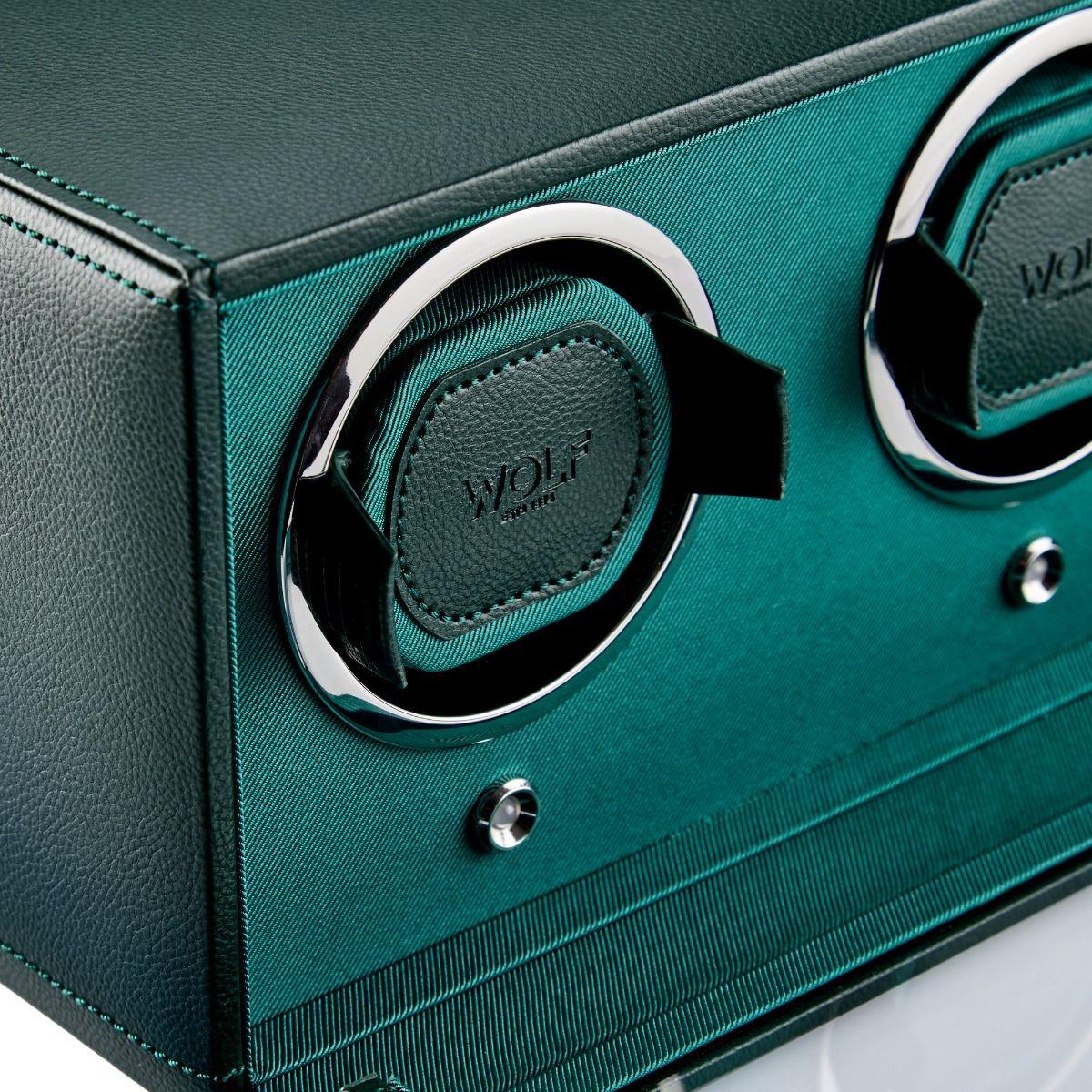 Double watch winder close-up: green cradle with WOLF logo and chrome ring