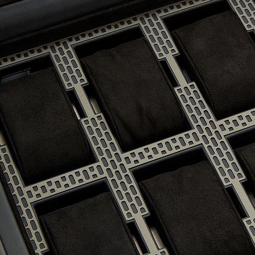 Close-up of black foam watch slots with gray perforated dividers