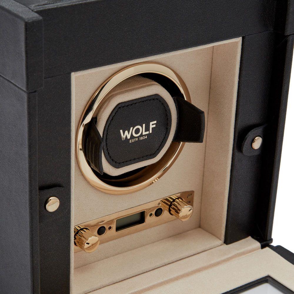 WOLF watch winder unit with beige interior, gold-toned dial and circular WOLF logo.