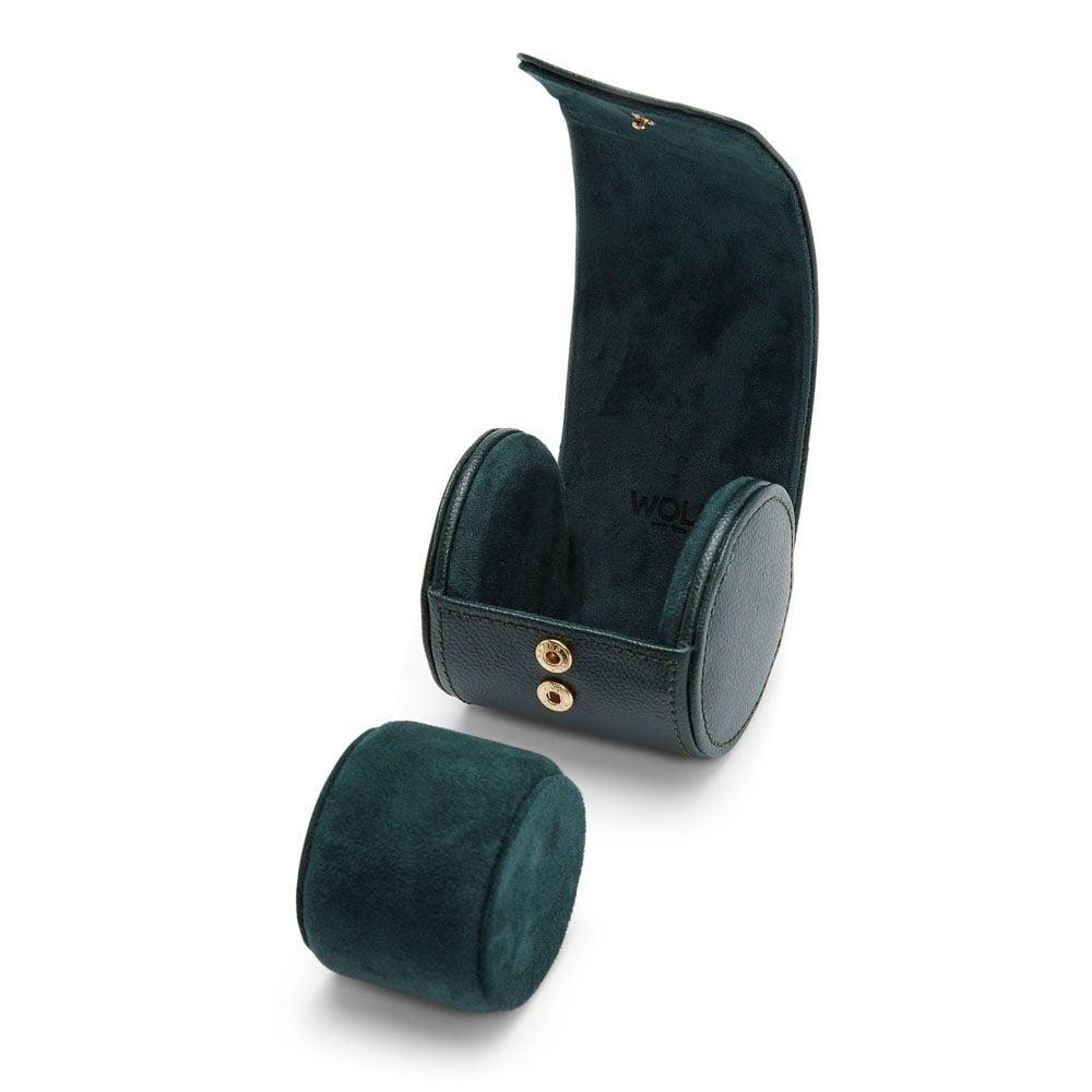 Green watch roll open with two rolled sections, gold snap closure, suede lining