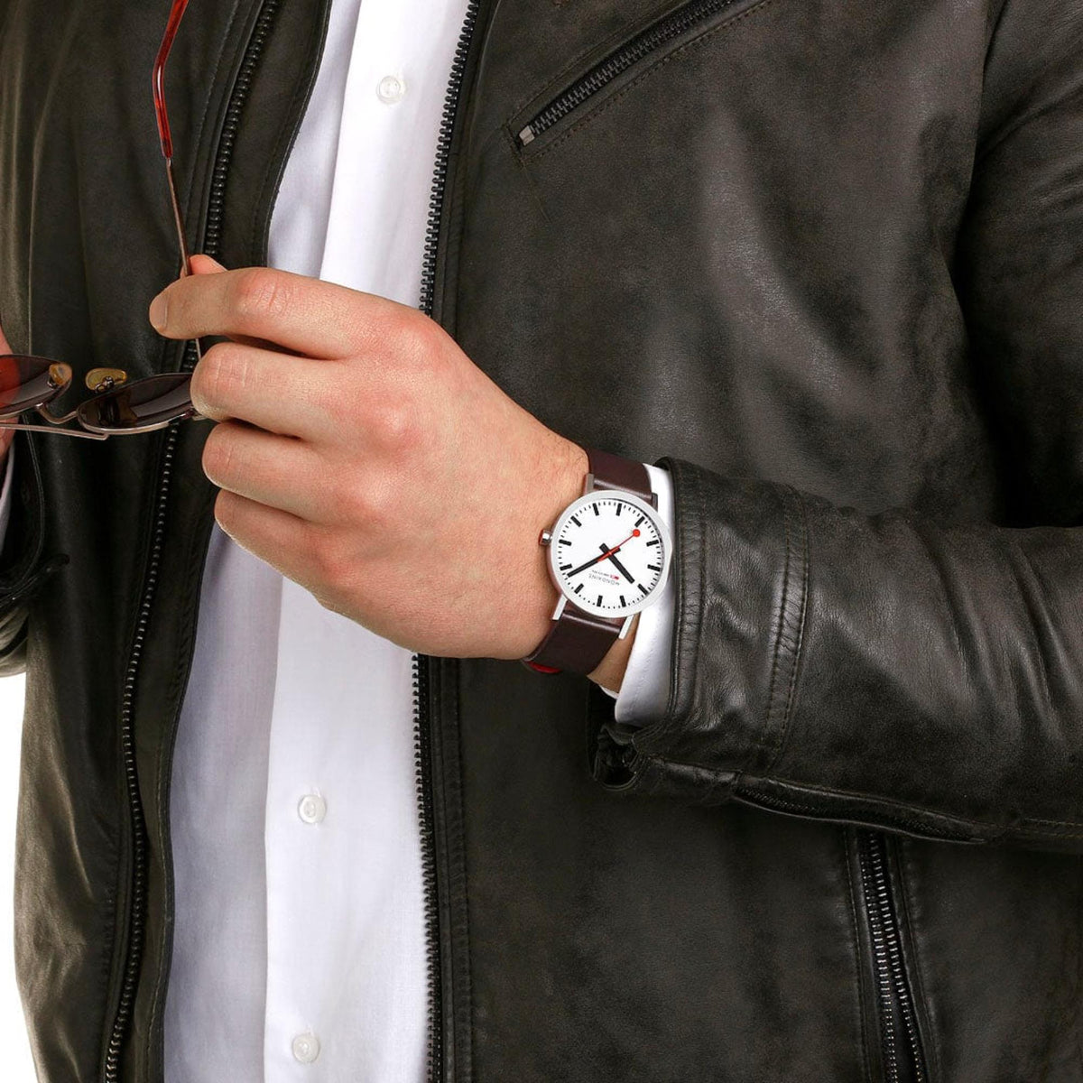Mondaine Classic 40mm men's quartz watch on wrist, white dial, dark leather strap