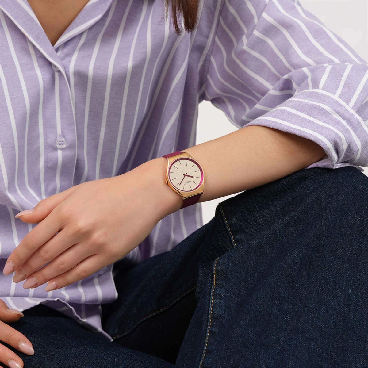 Burgundy leather strap watch, cream dial, gold case, red minimalist hands