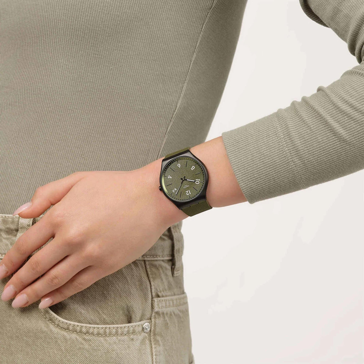 Pine green dial rubber strap watch with black case, shown on wrist