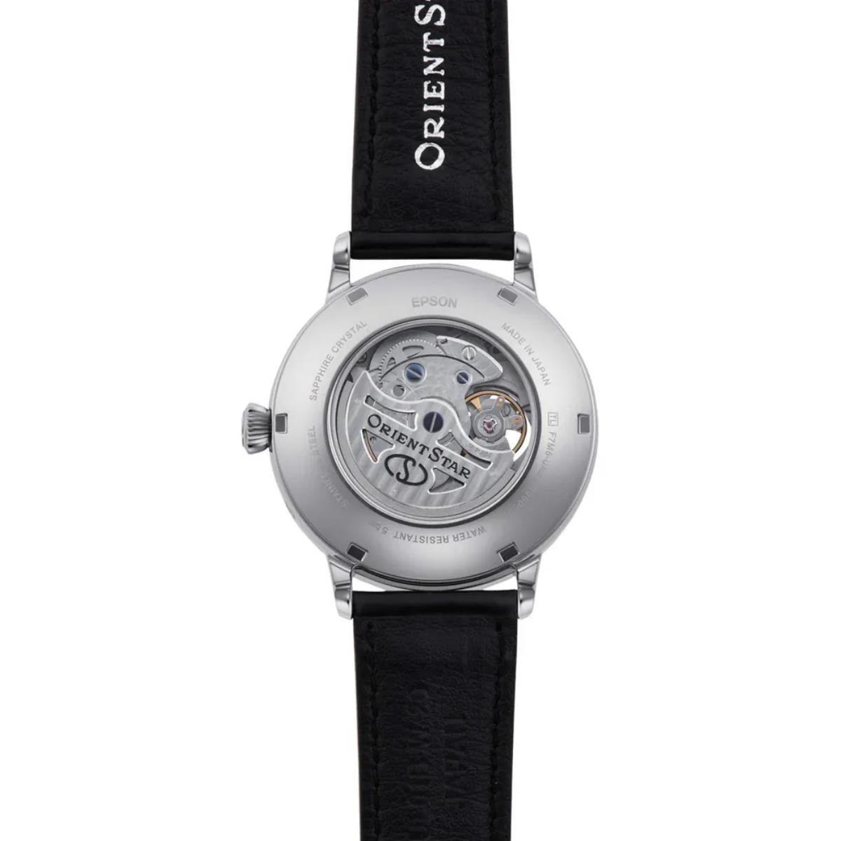 Semi-skeleton automatic watch with silver case, black leather strap, and visible movement